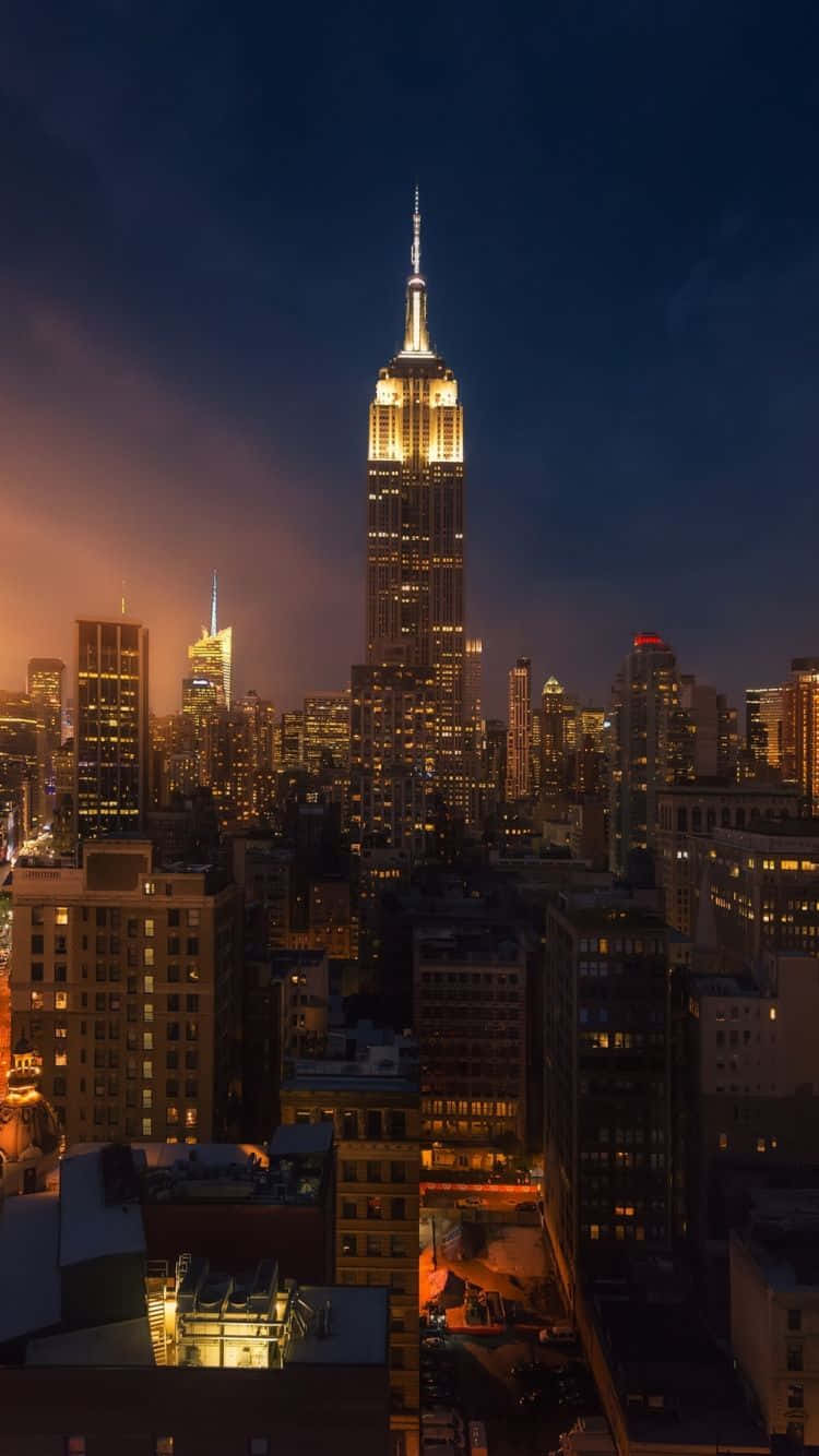 Enstadsvy Med Empire State Building På Natten. Wallpaper
