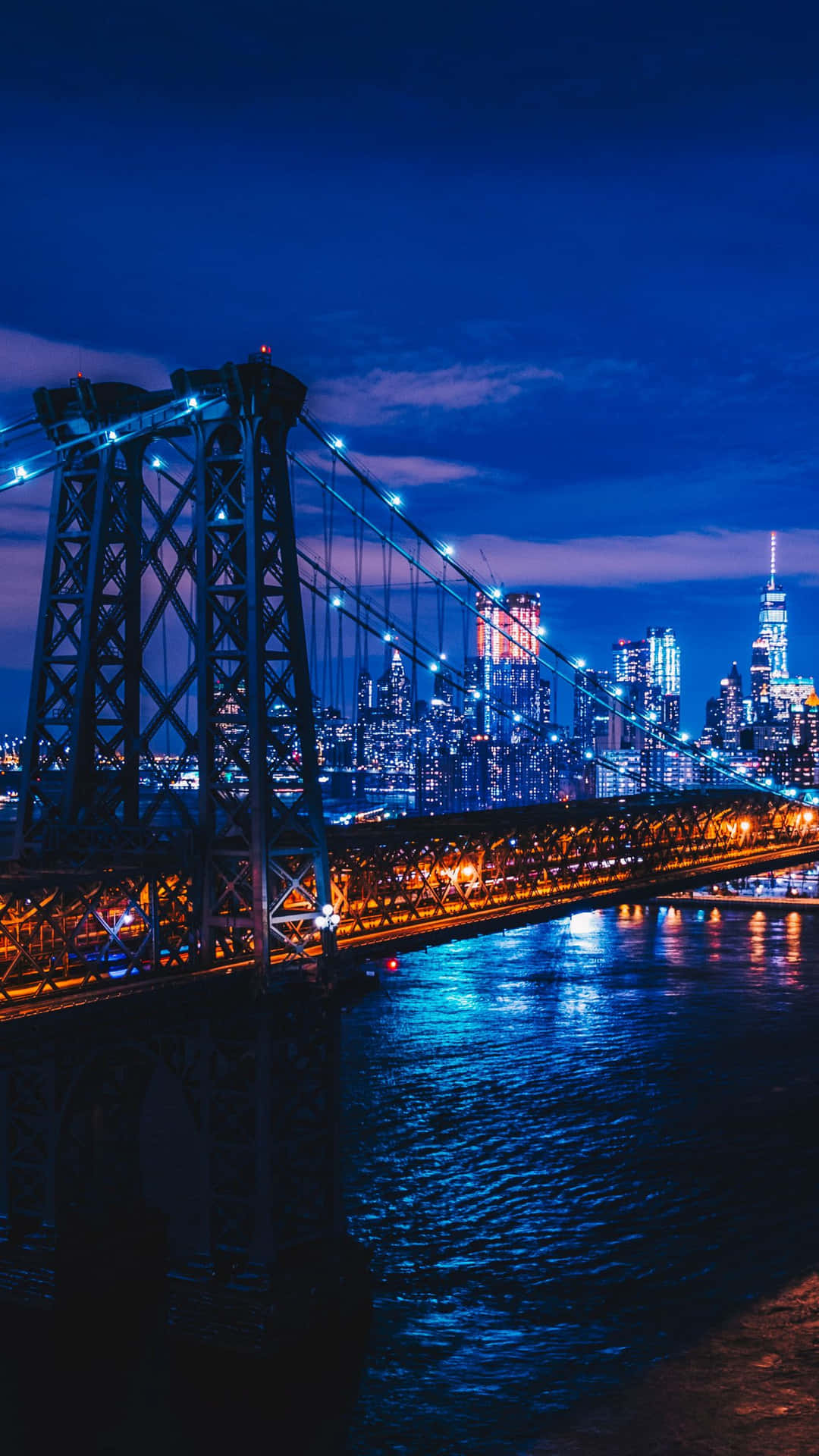 Experience the iconic views of New York City at night Wallpaper
