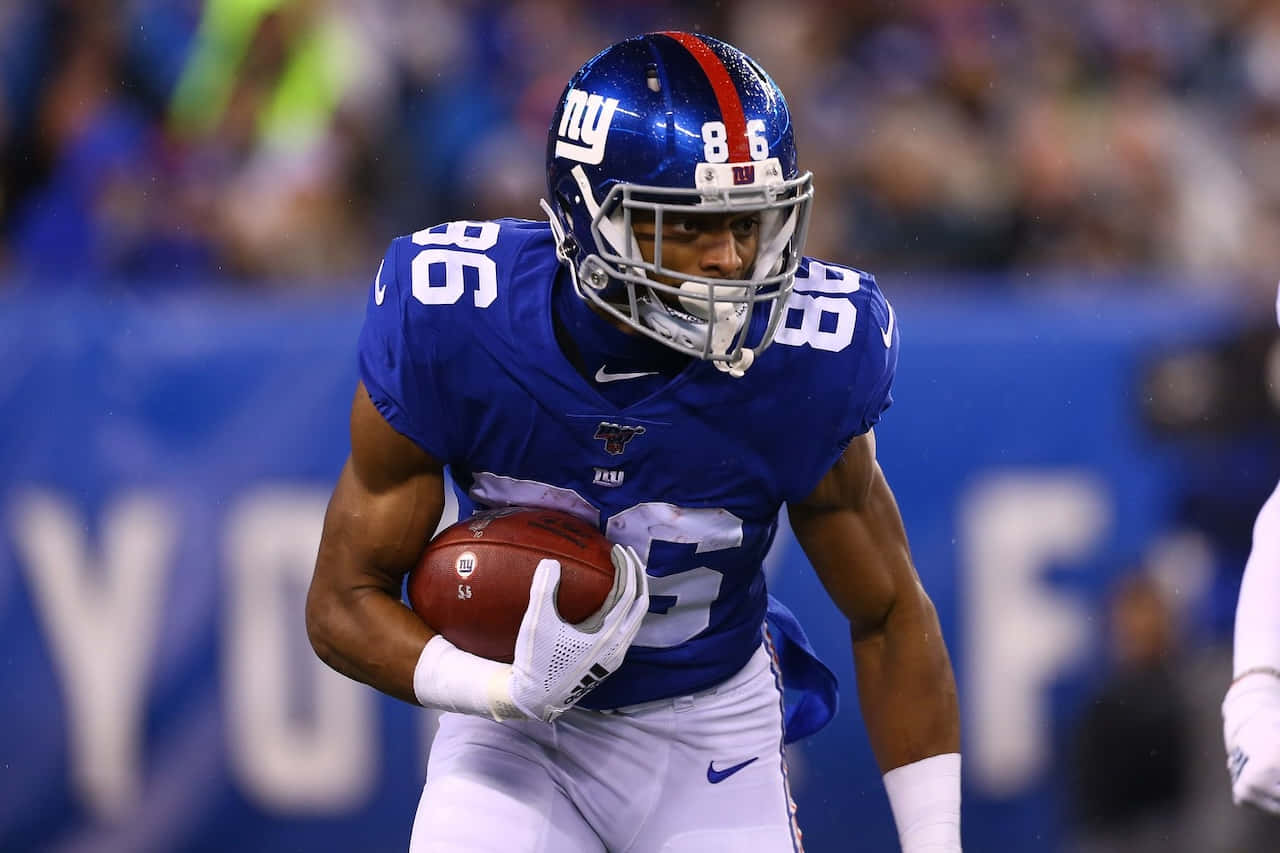 New York Giants Player Running With Football Wallpaper