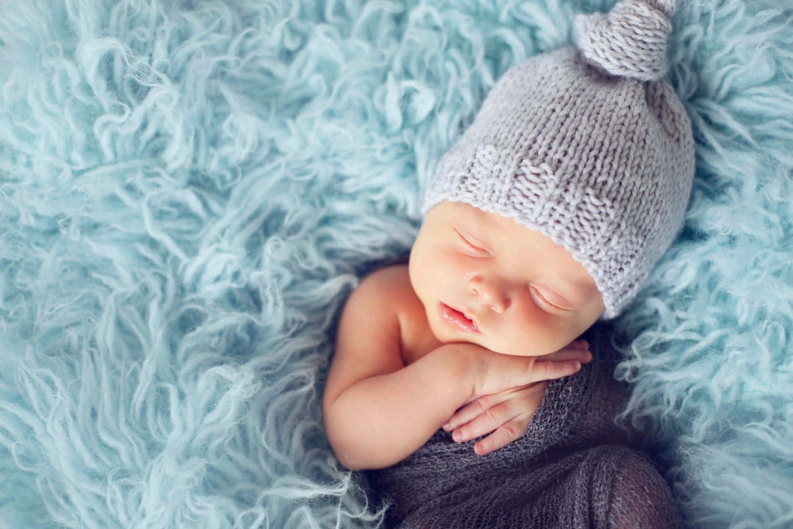 A precious newborn baby soundly sleeping