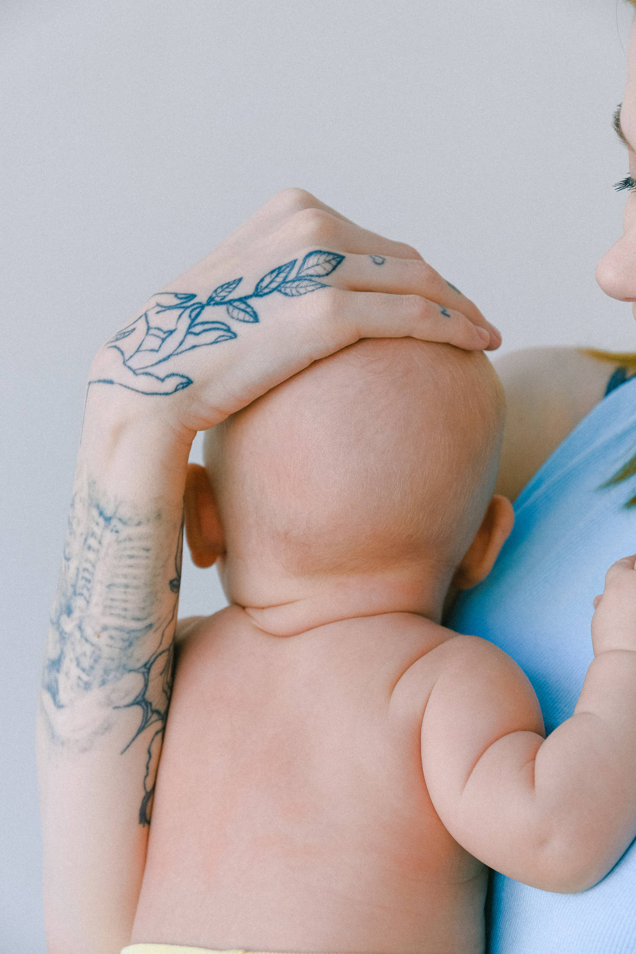 Newborn Baby Girl Arm Tattoo