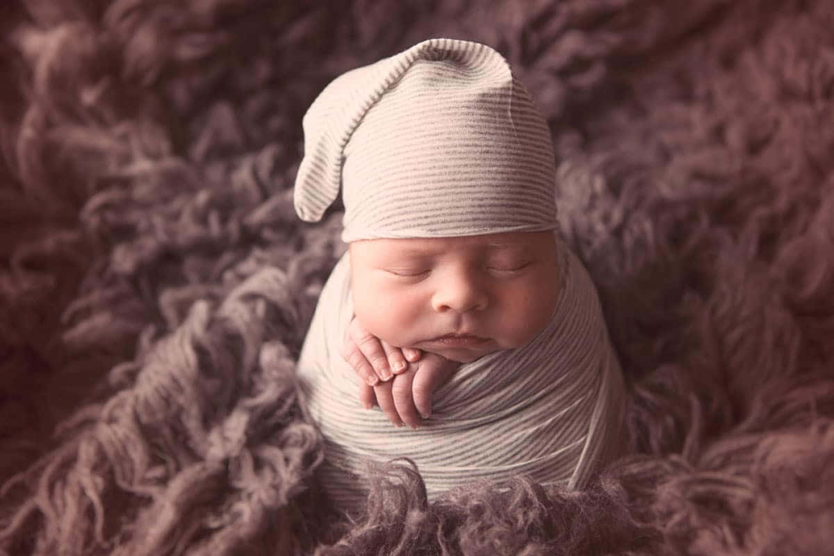 Adorable Newborn Boy Resting Peacefully