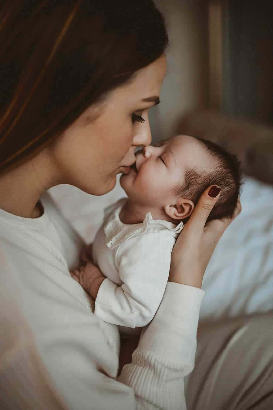 Newborn Kissed By Mother Pictures