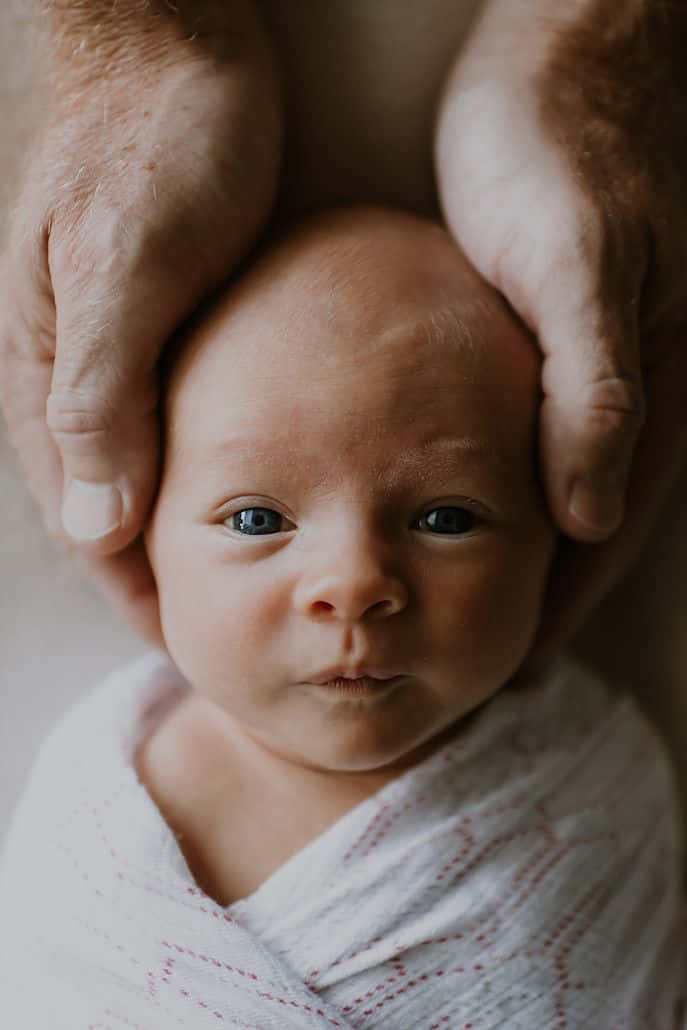 Newborn Caressing Hands Pictures