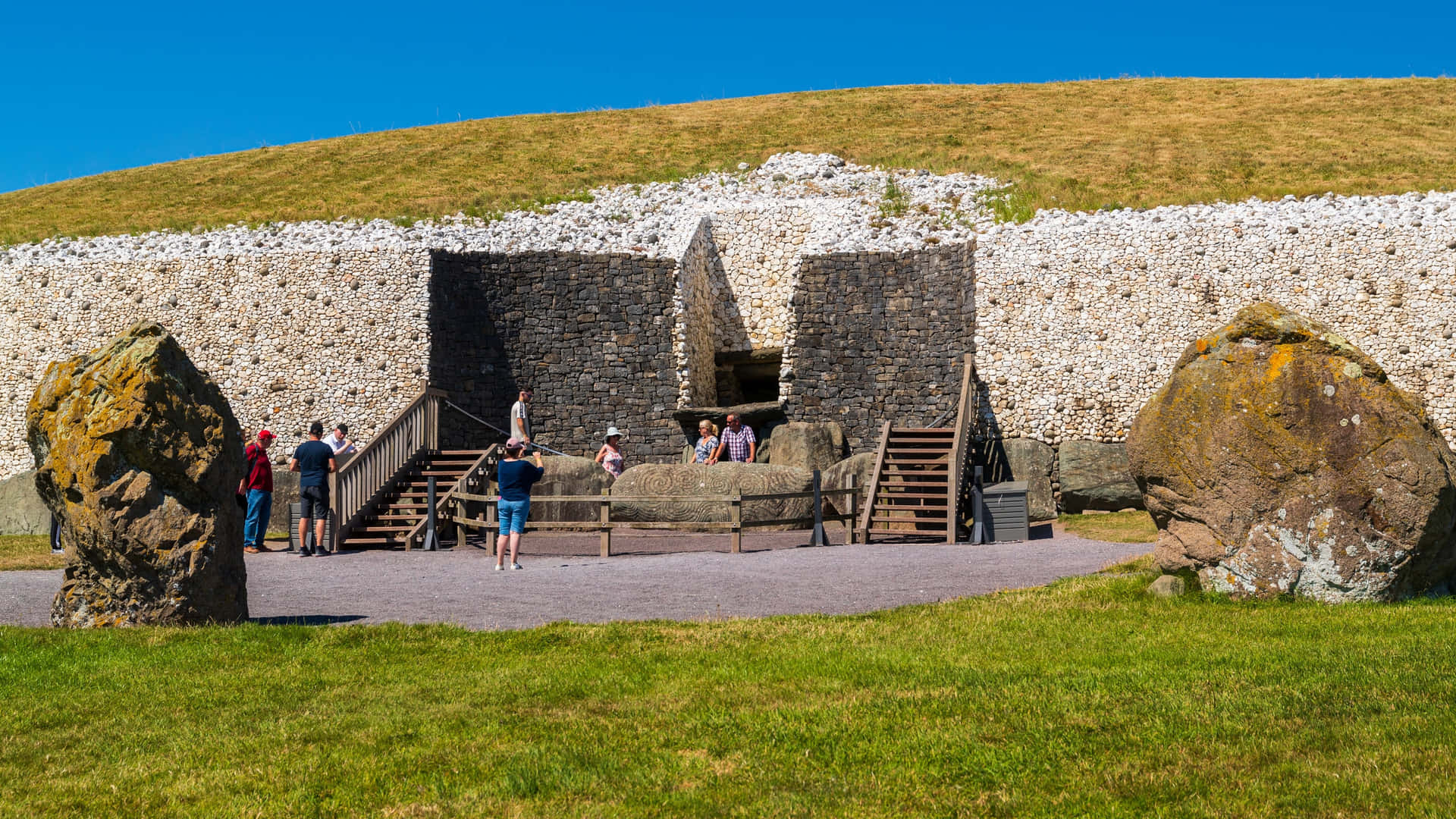 Newgrange With Tourists Taking Pictures Wallpaper