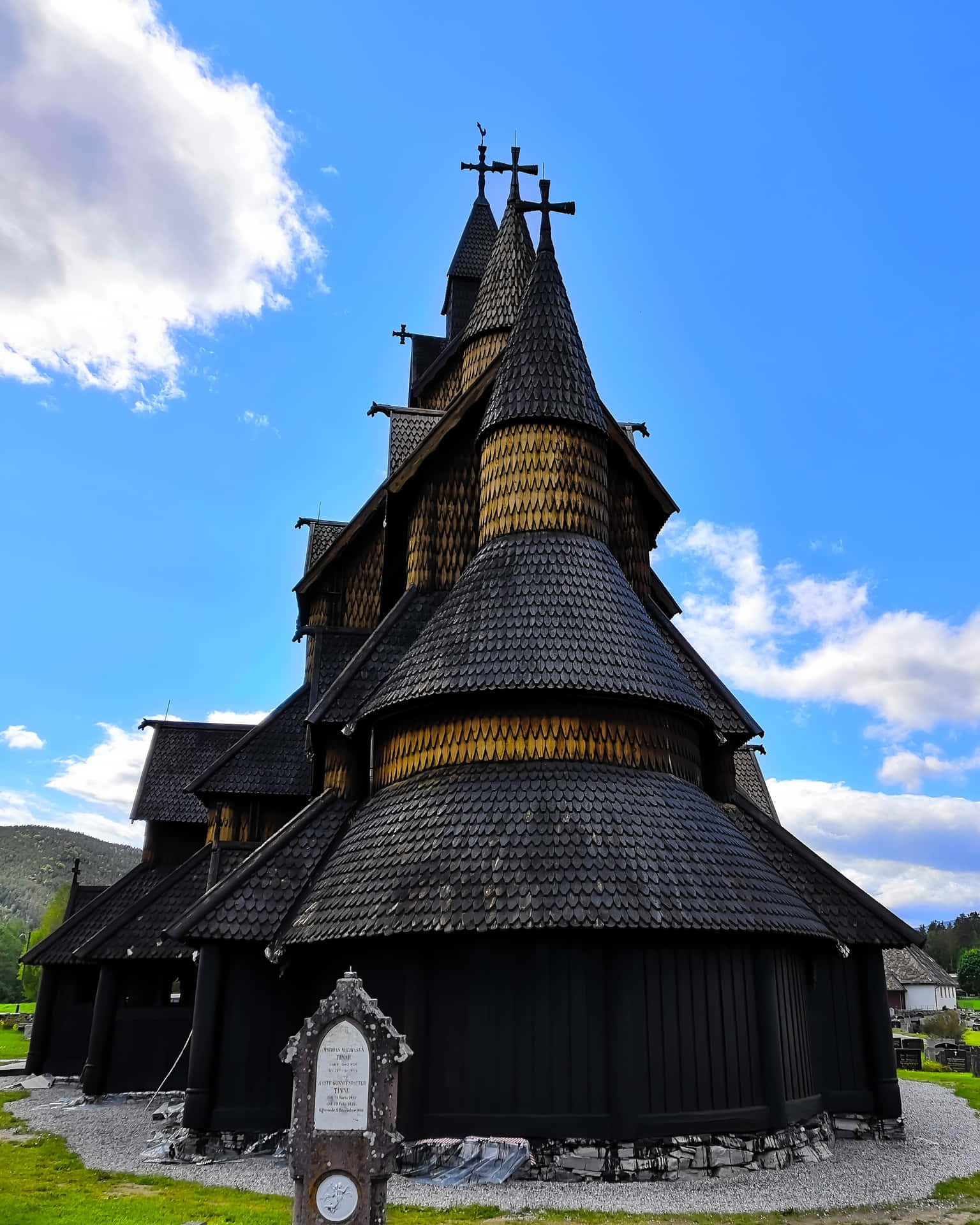 Majestic View of Newly Tarred Heddal Stave Church Wallpaper