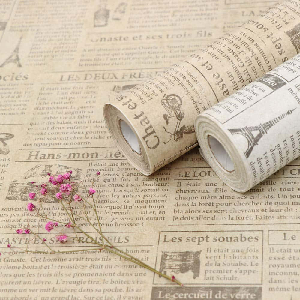 Newspaper Wall Decoration Rolls With Pink Flowers Background