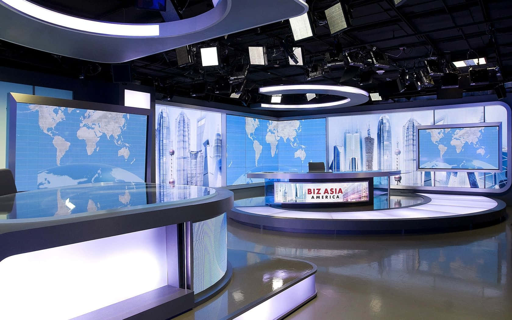 A News Studio With A Large Screen And Lights