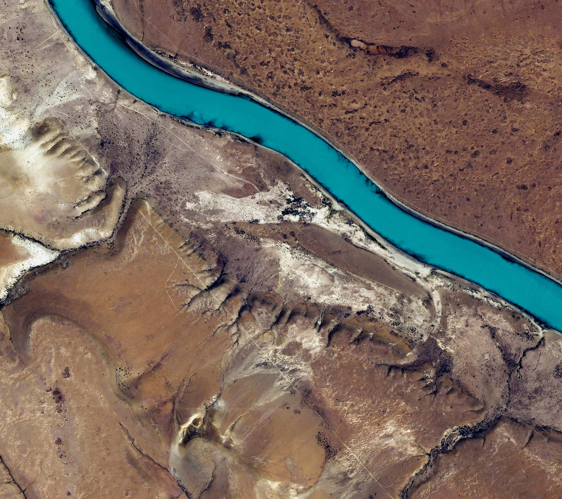 A Satellite Image Of A River In The Desert Wallpaper