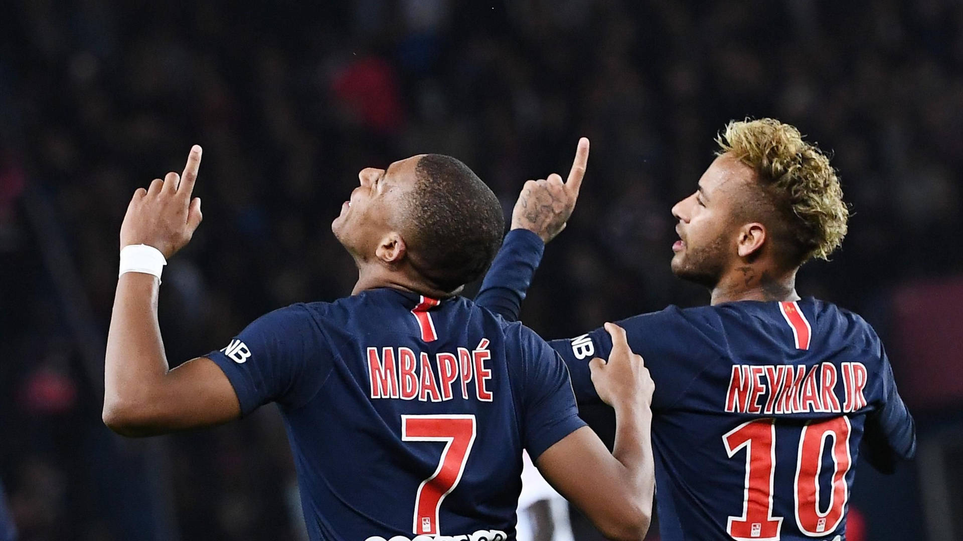 Neymar And Mbappe Pointing Above Wallpaper