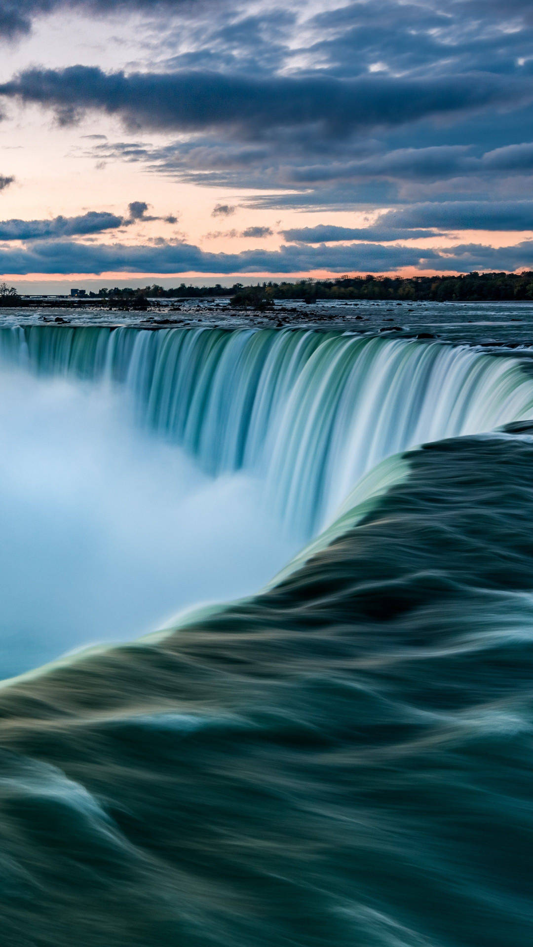 Majestic Niagara Falls Illuminated at Night Wallpaper