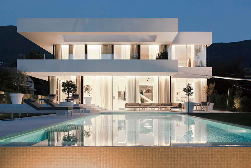 Modern Villa With Pool And Lounge Chairs
