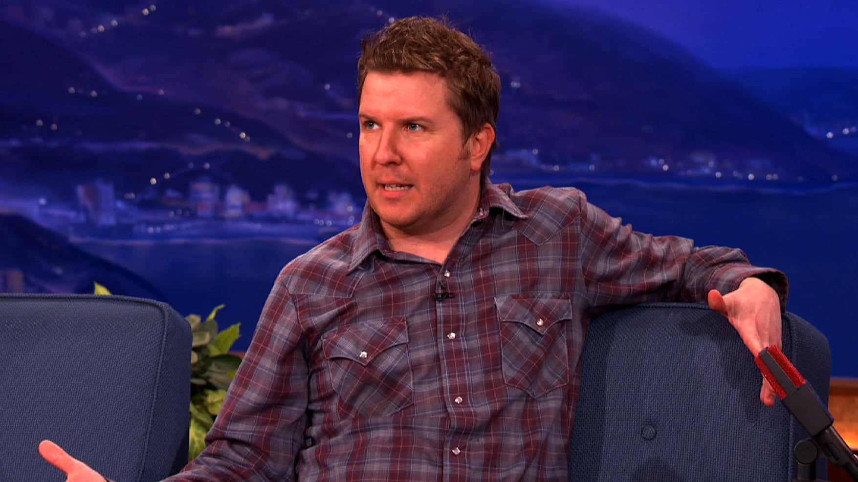 Comedian and actor Nick Swardson looks cool and confident on stage. Wallpaper