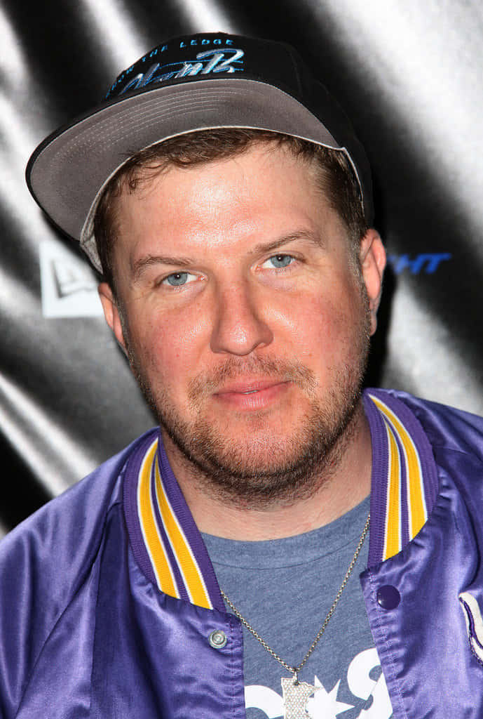 Comedian Nick Swardson strikes a goofy pose for the camera Wallpaper