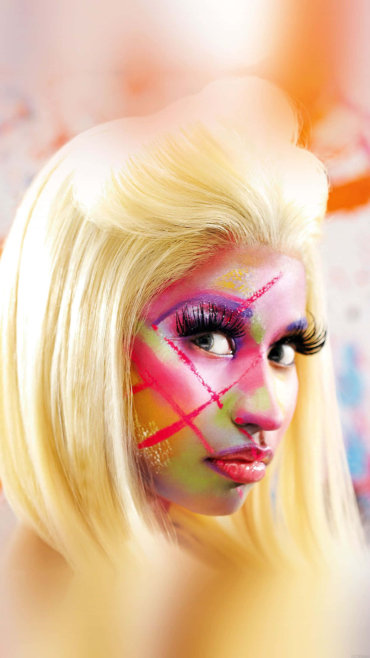 Nicki Minaj striking a fierce pose in a colorful outfit