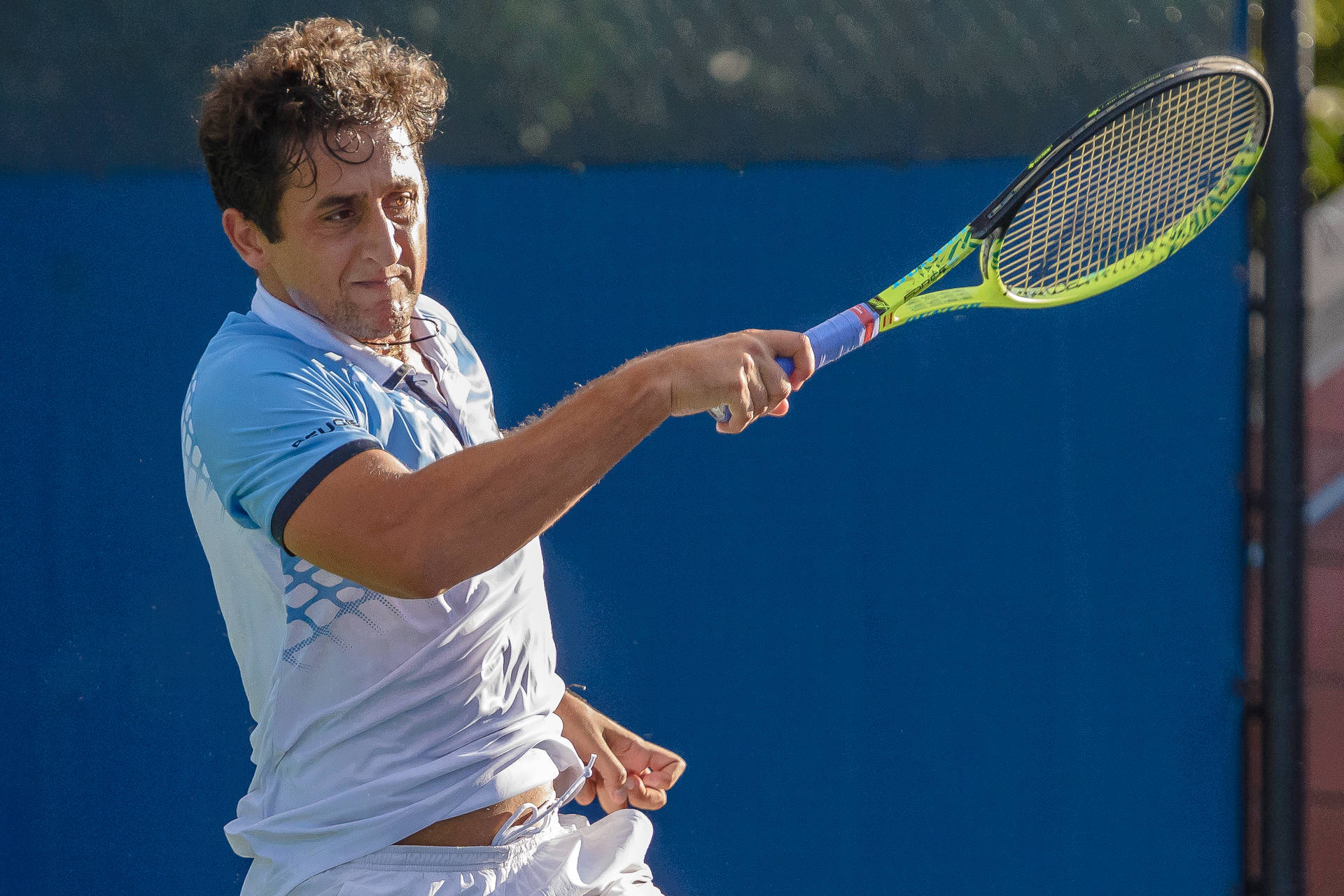 Caption: Nicolas Almagro Exhausted but Satisfied After a Rigorous Tennis Match Wallpaper
