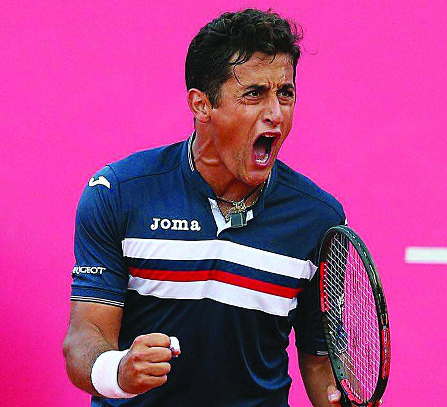 Nicolas Almagro Celebrating Victory- Intense Tennis Match Moment Wallpaper