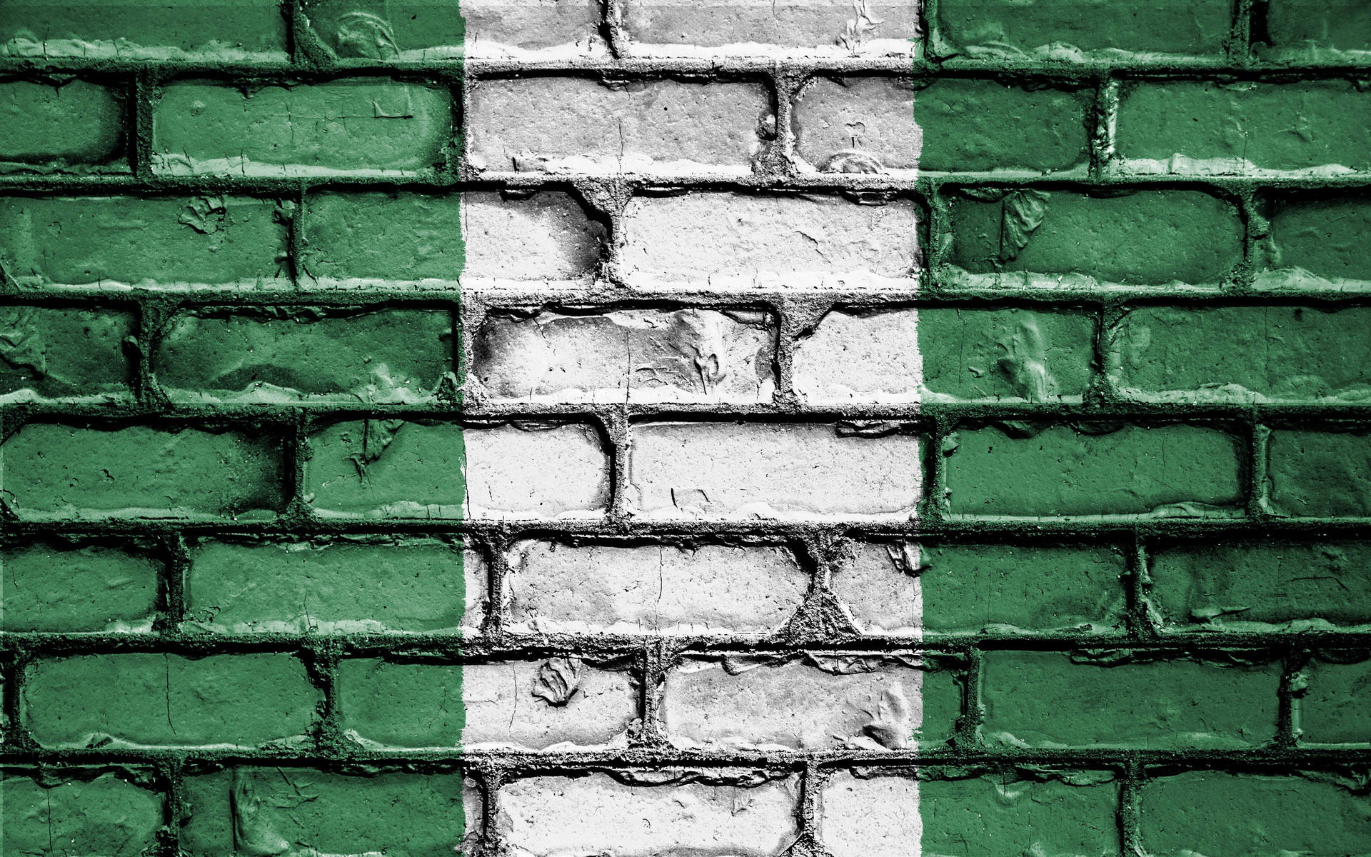 Caption: Vibrant Nigerian Colors on a Vintage Brick Wall Wallpaper