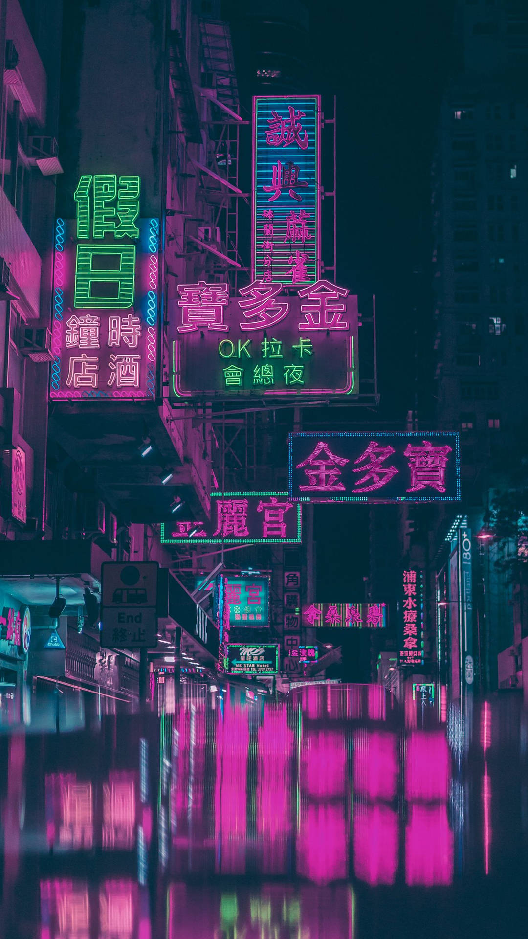 Neon skilte i en by om natten Wallpaper