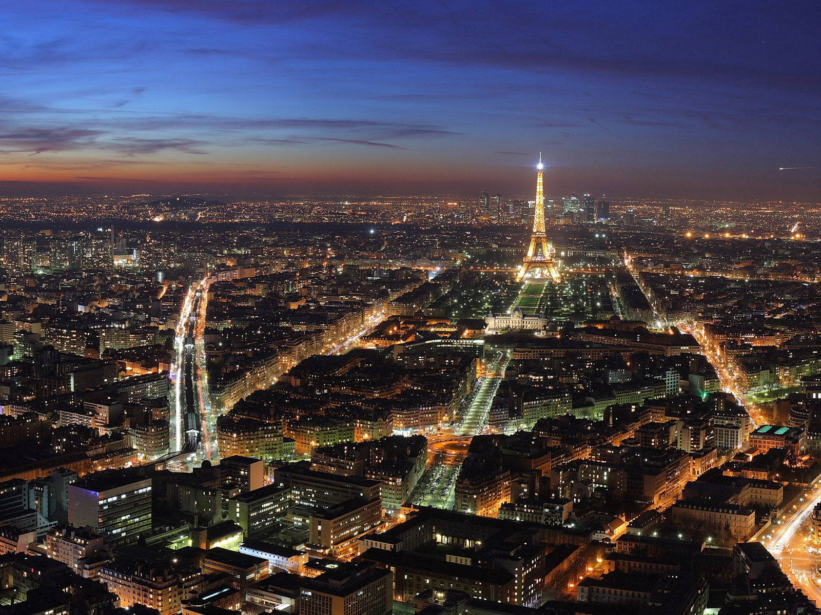 Aerial night view of the city of lights - Paris, France Wallpaper