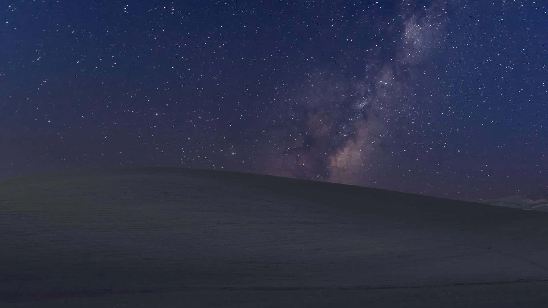 Serene Night Sky Illuminated By Dazzling Stars Wallpaper