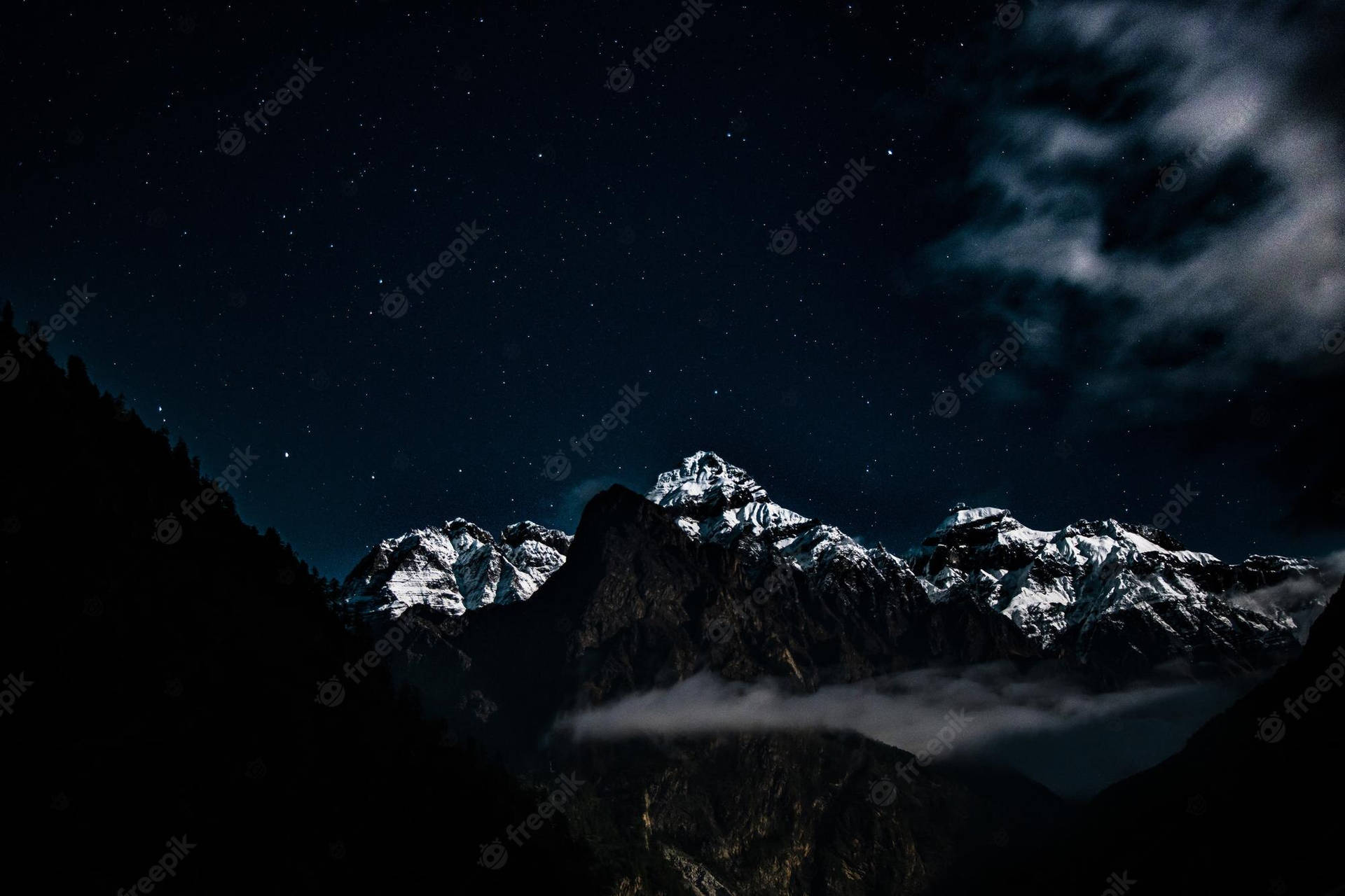 Mountain Range At Night With Clouds And Stars Wallpaper