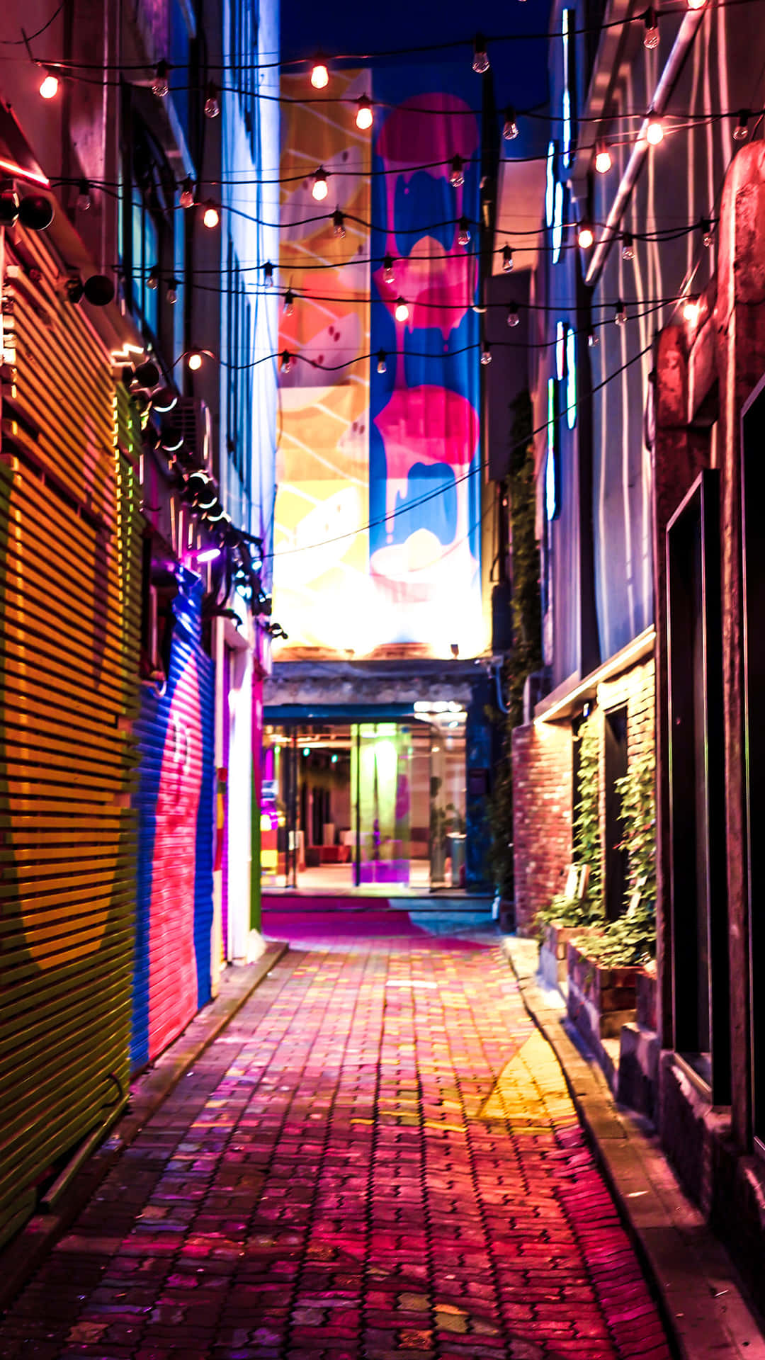 A Brick Walkway With Colorful Lights