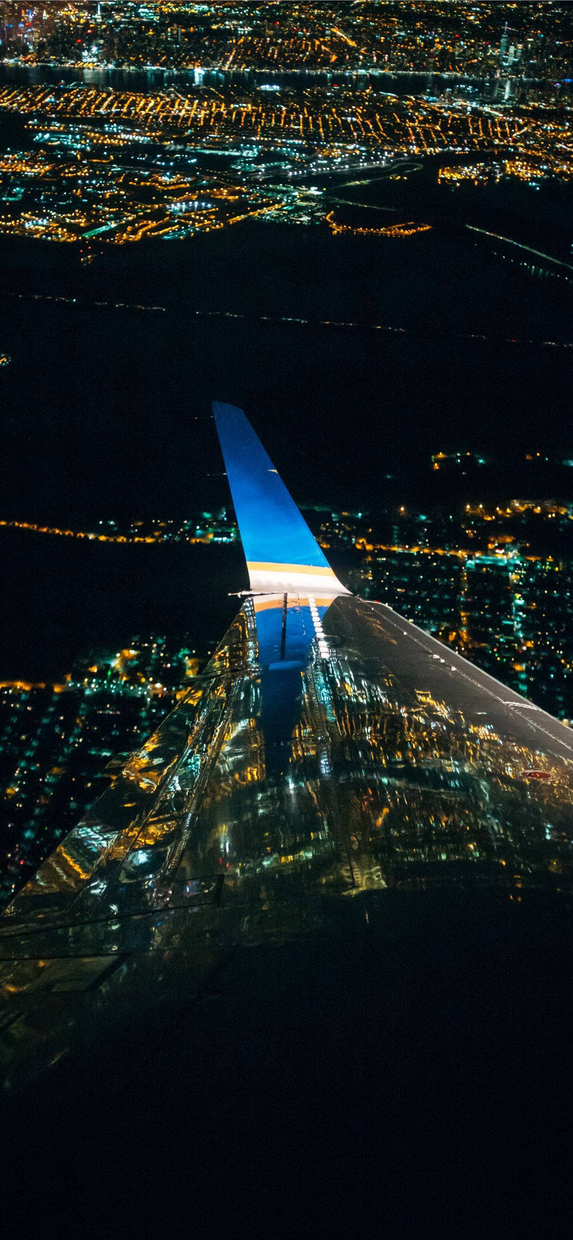 Night View Of Flying Airplane Android Wallpaper