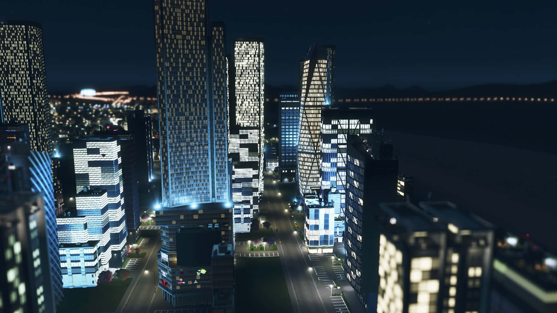 Nighttime City Skyline Illuminated Buildings Wallpaper