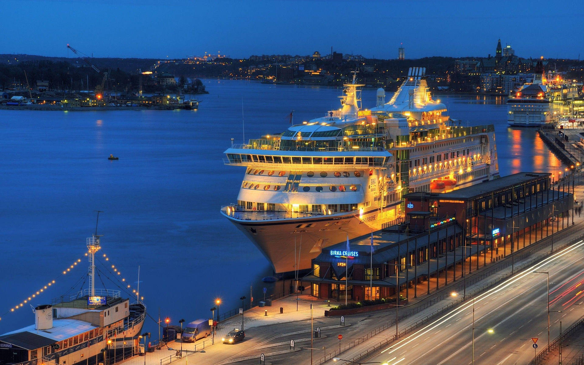 Nighttime Cruise Ship In Stockholm Wallpaper