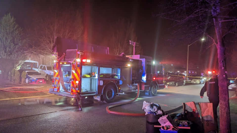 Nighttime Emergency Response Firetruckand Police Wallpaper