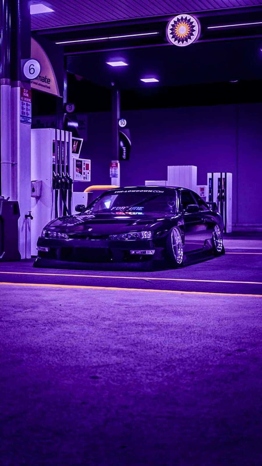 Nighttime J D M Car At Gas Station Wallpaper