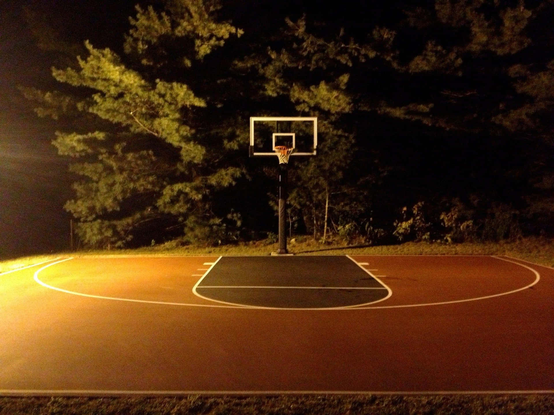 Nighttime Outdoor Basketball Court Wallpaper