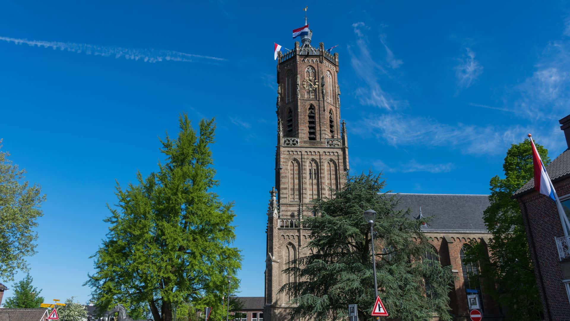 Nijmegen Church Tower Under Blue Sky Wallpaper