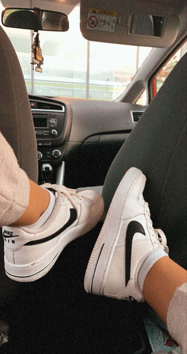 Man Showing Nike Air Force 1 Inside A Car Picture