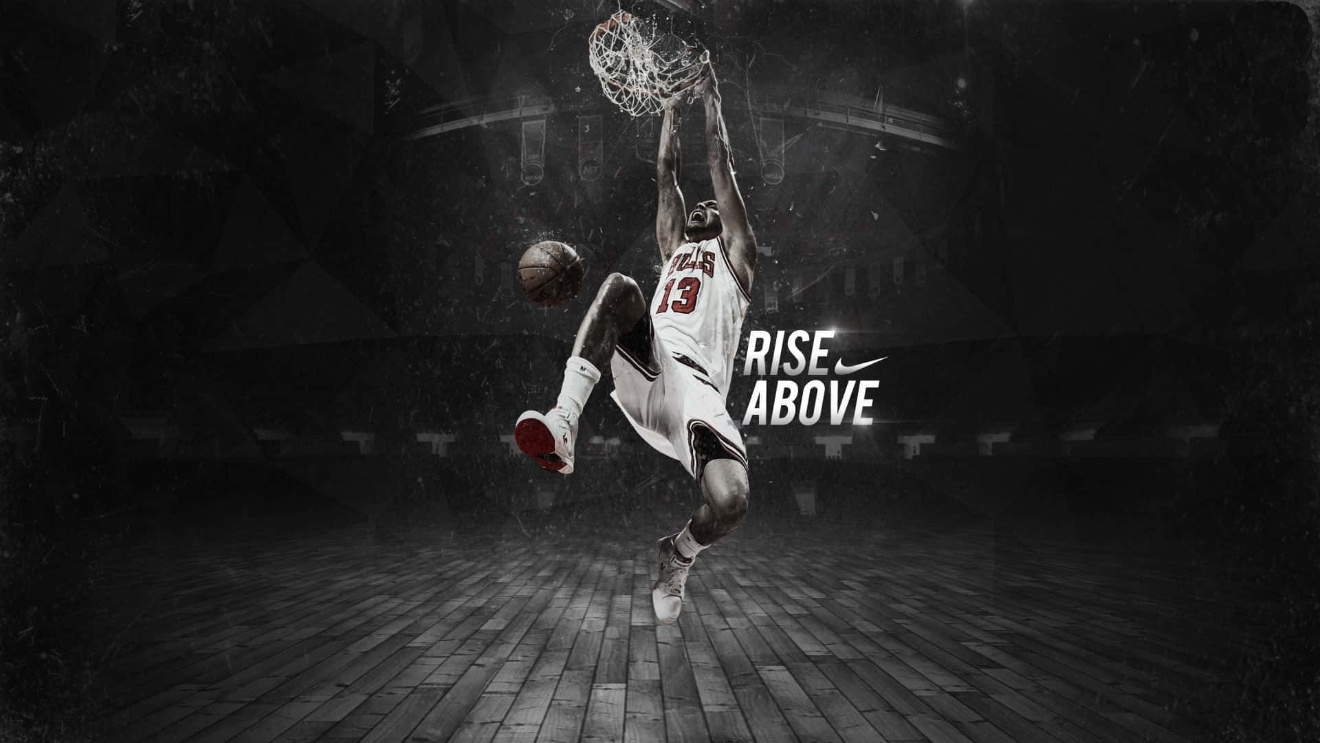 A Basketball Player Is Dunking The Ball In A Dark Background Wallpaper