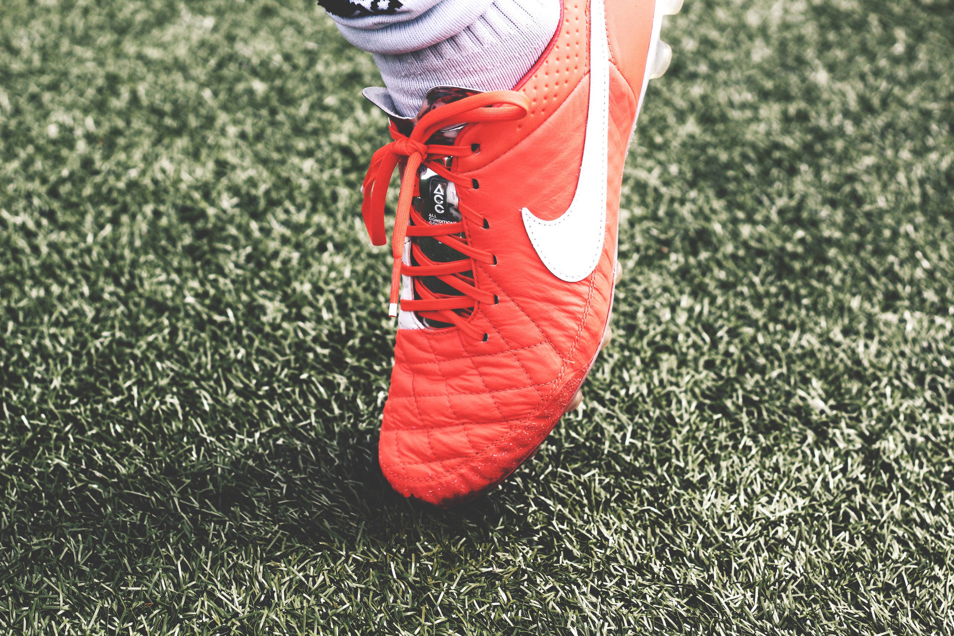 Take Control Of The Game With Nike Football Shoes Wallpaper