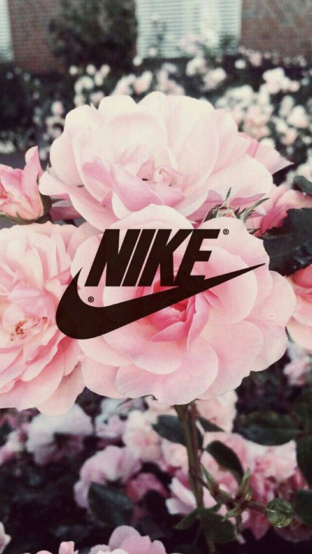 Nike Girl Logo Over Pink Roses Wallpaper