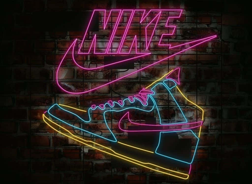 Inseguimentodi Scarpe Nike Al Neon Su Muro Di Mattoni Sfondo