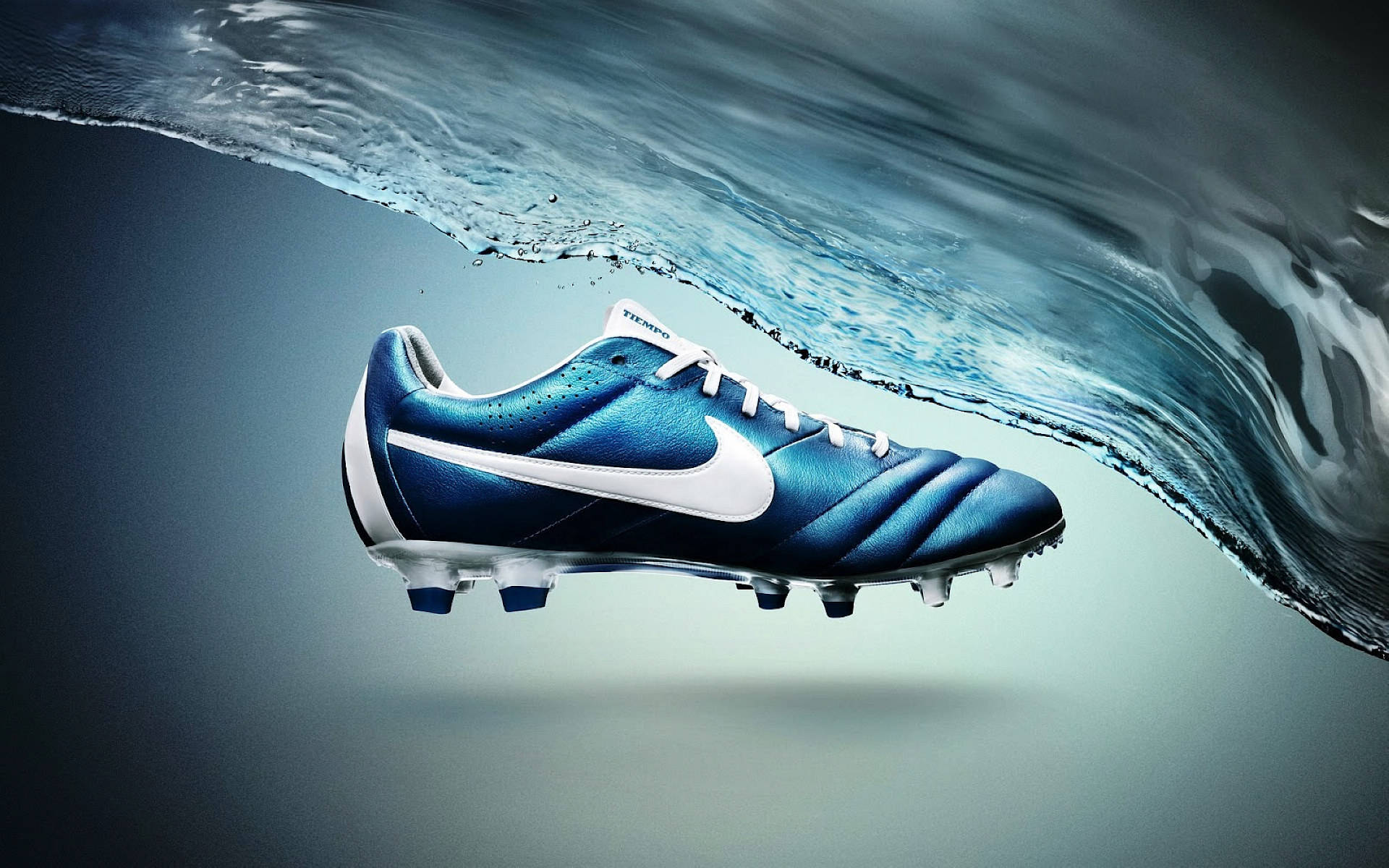 Zapatosnike De Fútbol Azules Con Tecnología Acc. Fondo de pantalla