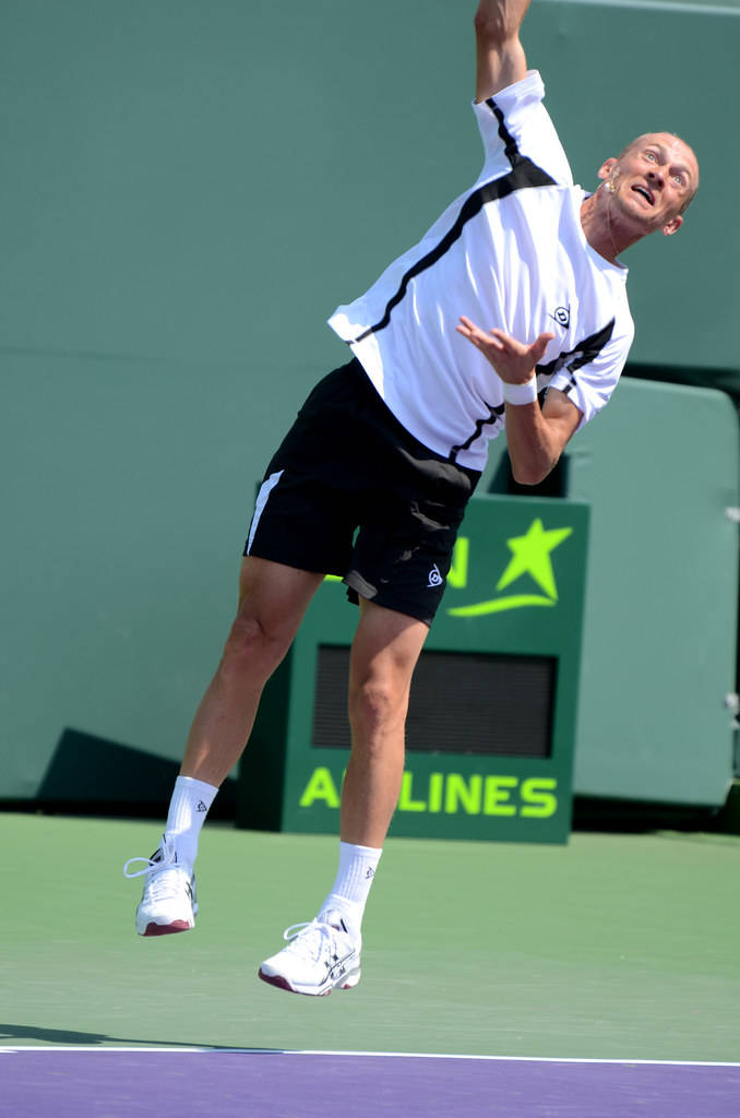 Nikolay Davydenko High Serve Tennis Action Wallpaper