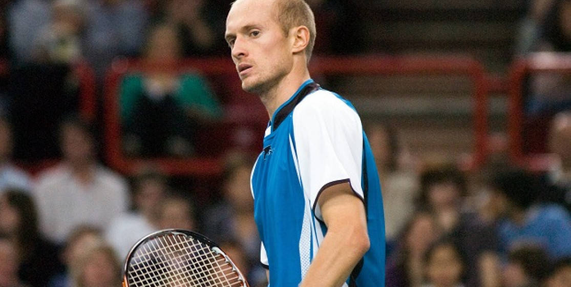 Professional Tennis Player Nikolay Davydenko Focused on Game Wallpaper