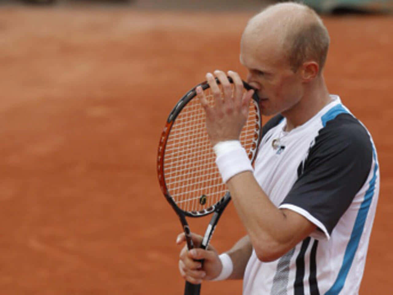 Nikolay Davydenko Pondering Tactics on the Tennis Court Wallpaper