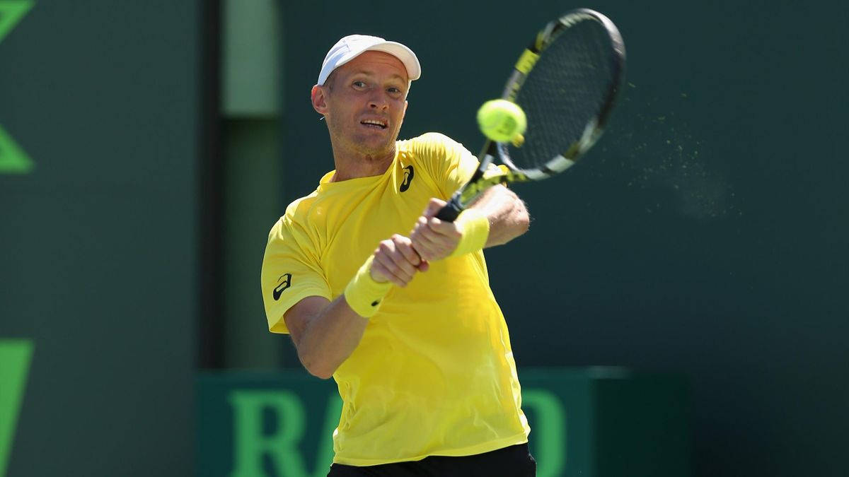 Caption: Nikolay Davydenko in action with a two-handed swing Wallpaper