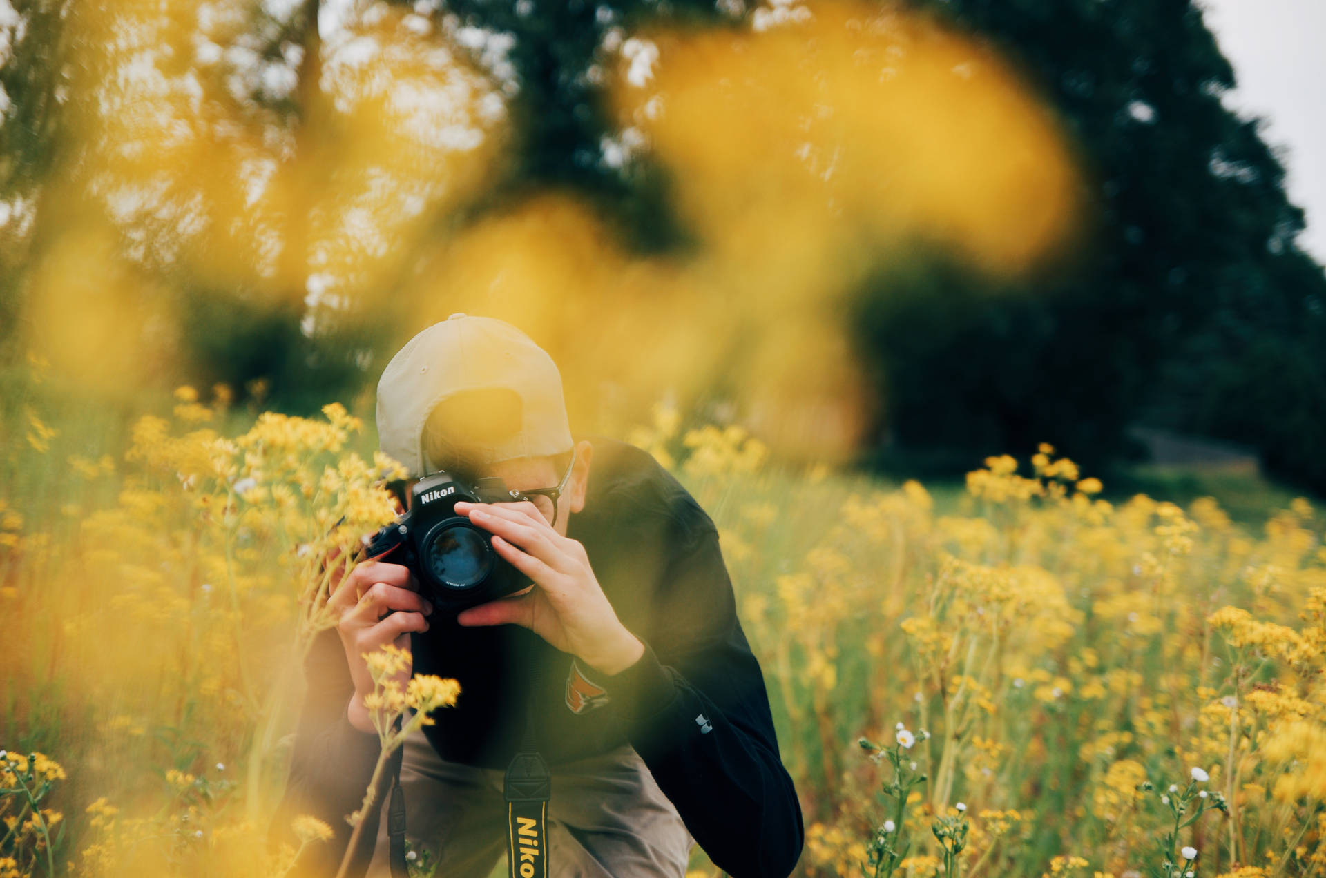 Capture Your Moment with Nikon DSLR Camera Wallpaper
