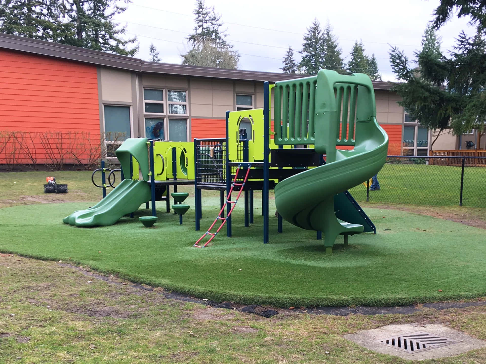 Niñosdisfrutando Del Tiempo De Juego En Un Parque Colorido