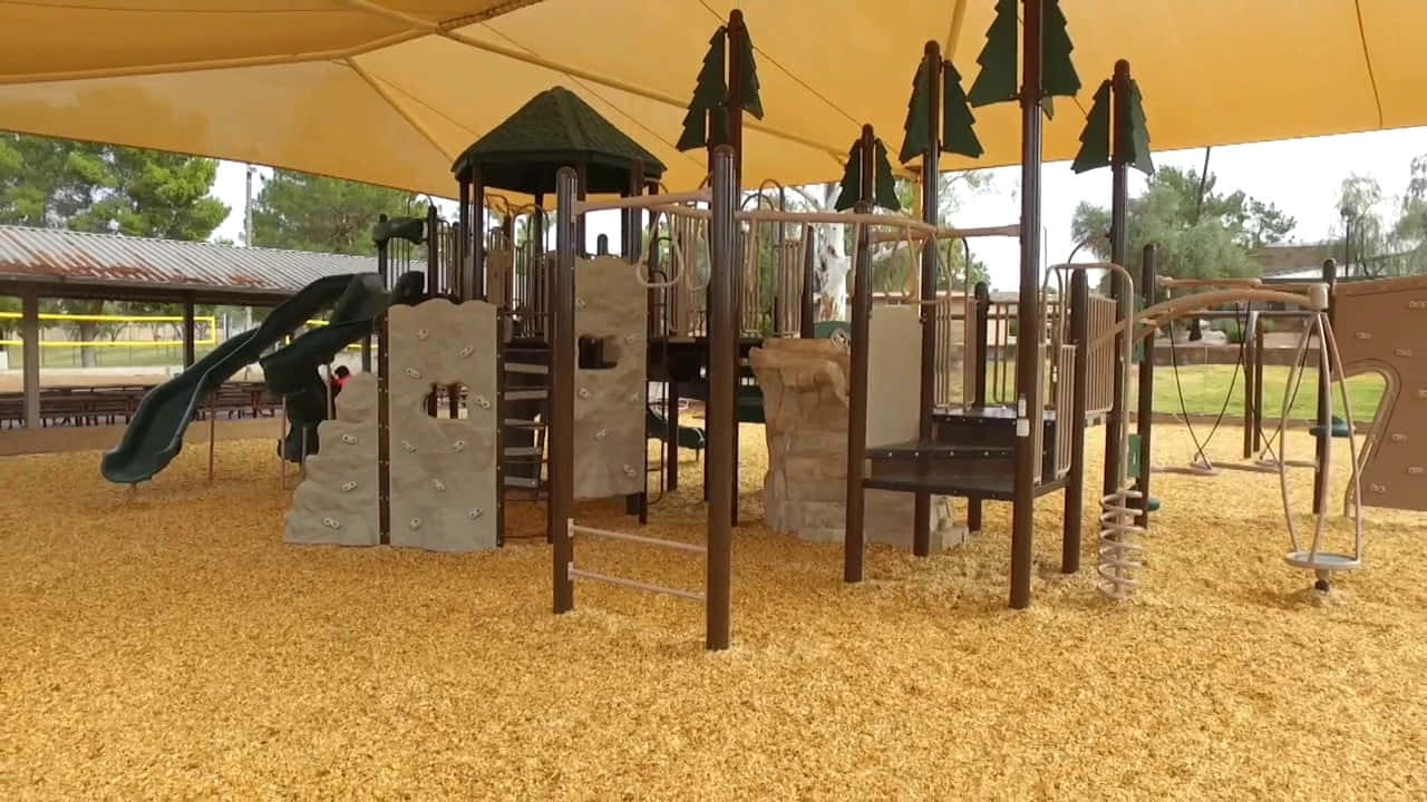 Niñosjugando En Un Colorido Equipo De Juegos En El Parque.