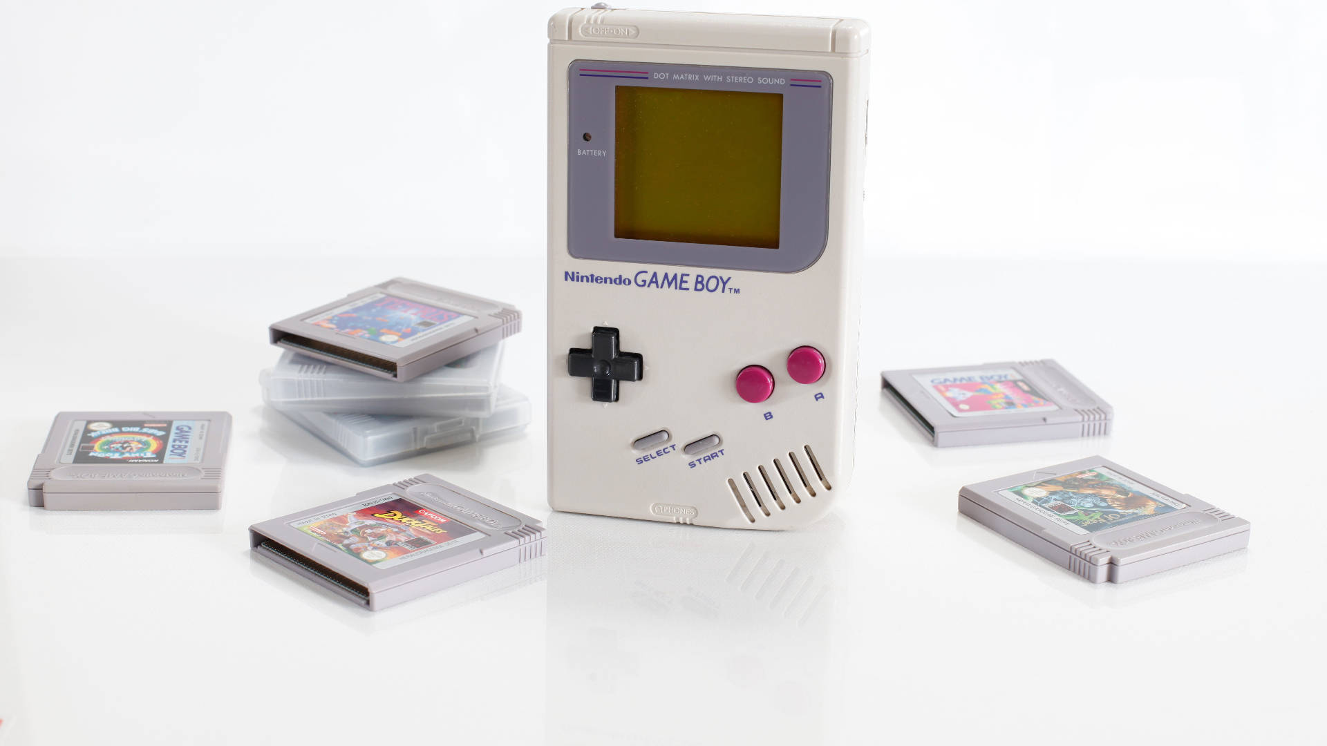 Et billede af en Nintendo Game Boy-konsol med kassetter. Wallpaper
