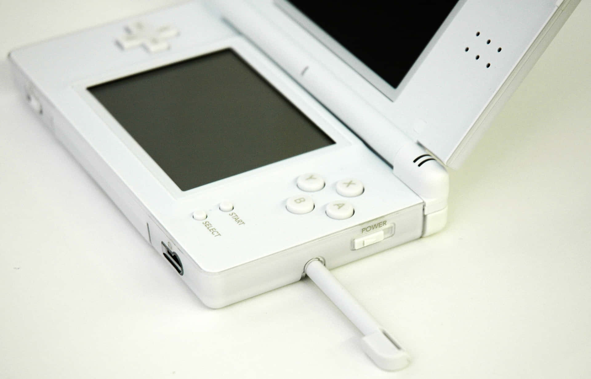 A White Nintendo Ds Is Sitting On A White Surface