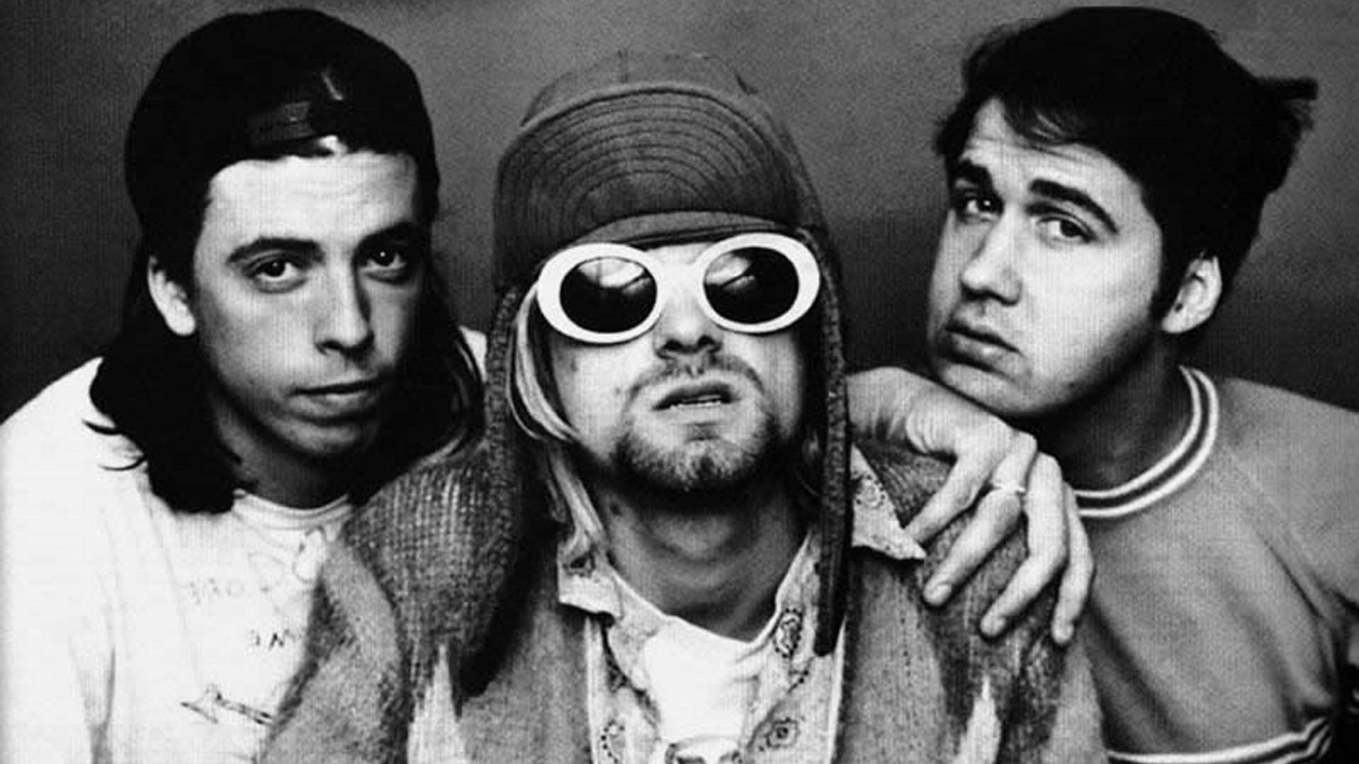 Nirvana Band Medlemmer afbilledet på et tæppe af trådløse digitale pixellys Wallpaper